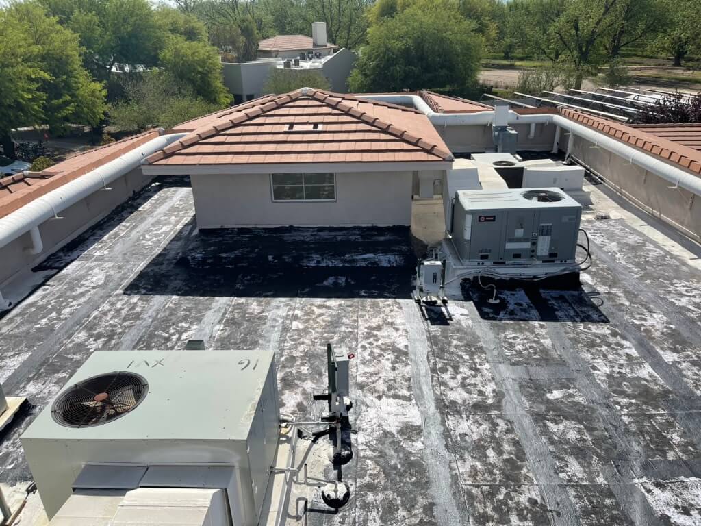 Visible sun damage on a flat roof in Tucson that has been inspected ahead of a roof maintenance project